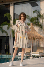 White summer dress with long line of embriodery